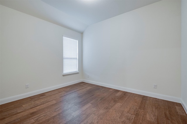 14601 Donner Trl, Fort Worth, TX 76262 - unfurnished room with dark wood finished floors, baseboards, and vaulted ceiling