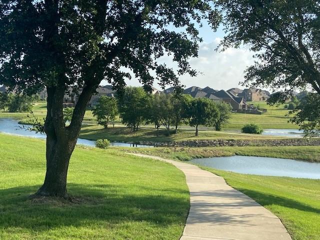 14601 Donner Trl, Fort Worth, TX 76262 - view of community featuring a water view and a yard