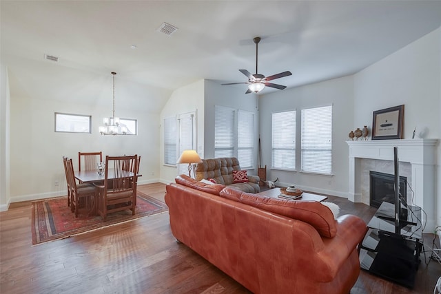 14601 Donner Trl, Fort Worth, TX 76262 - living area with a glass covered fireplace, a chandelier, wood finished floors, and vaulted ceiling