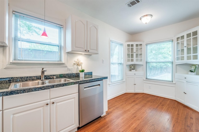5322 Stoneleigh Ave, Dallas, TX 75235 - kitchen with stainless steel dishwasher, a sink, light wood-style floors, and glass insert cabinets
