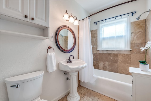 5322 Stoneleigh Ave, Dallas, TX 75235 - bathroom with toilet, shower / bath combo with shower curtain, tile patterned flooring, and baseboards