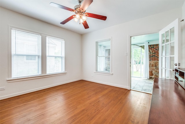 5322 Stoneleigh Ave, Dallas, TX 75235 - spare room with wood finished floors, baseboards, and a ceiling fan