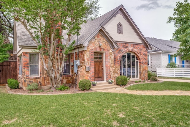 5322 Stoneleigh Ave, Dallas, TX 75235 - tudor house with stone siding, brick siding, a shingled roof, and stucco siding