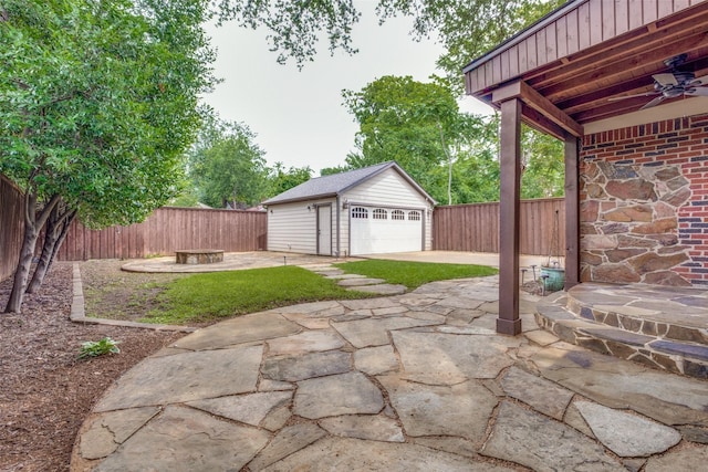 5322 Stoneleigh Ave, Dallas, TX 75235 - view of patio with a detached garage, an outdoor structure, and a fenced backyard