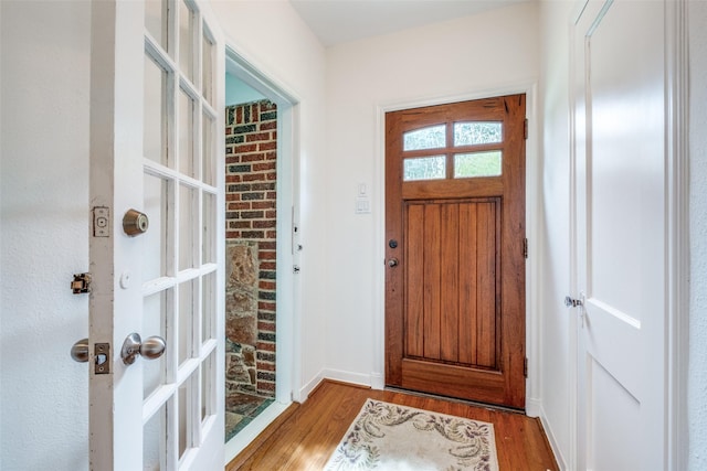 5322 Stoneleigh Ave, Dallas, TX 75235 - doorway with light wood-style floors and baseboards