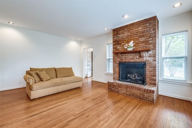 5322 Stoneleigh Ave, Dallas, TX 75235 - living area with light wood finished floors, baseboards, a fireplace, and recessed lighting