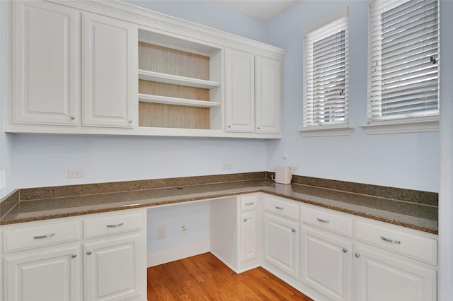 3706 Plum Vista Pl, Arlington, TX 76005 - kitchen with dark countertops, open shelves, light wood-type flooring, and white cabinets