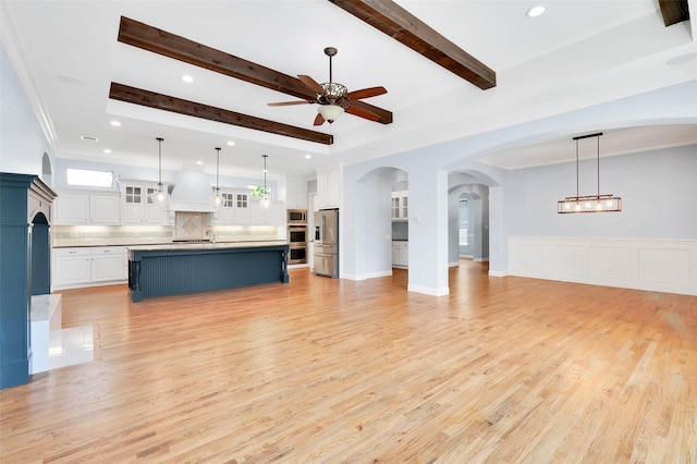 3706 Plum Vista Pl, Arlington, TX 76005 - unfurnished living room with ceiling fan, beamed ceiling, light wood-style flooring, recessed lighting, and a sink