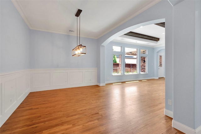 3706 Plum Vista Pl, Arlington, TX 76005 - unfurnished dining area with crown molding, light wood-type flooring, arched walkways, and baseboards