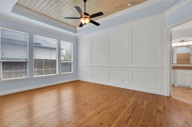 3706 Plum Vista Pl, Arlington, TX 76005 - unfurnished room featuring a tray ceiling, light wood-type flooring, a ceiling fan, crown molding, and a decorative wall