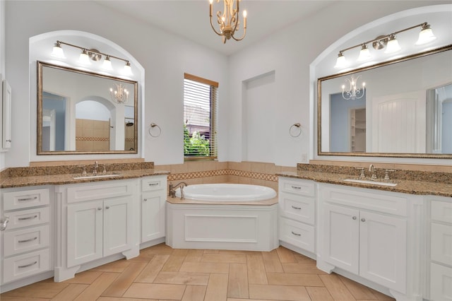 3706 Plum Vista Pl, Arlington, TX 76005 - full bath with a chandelier, a bath, two vanities, and a tile shower