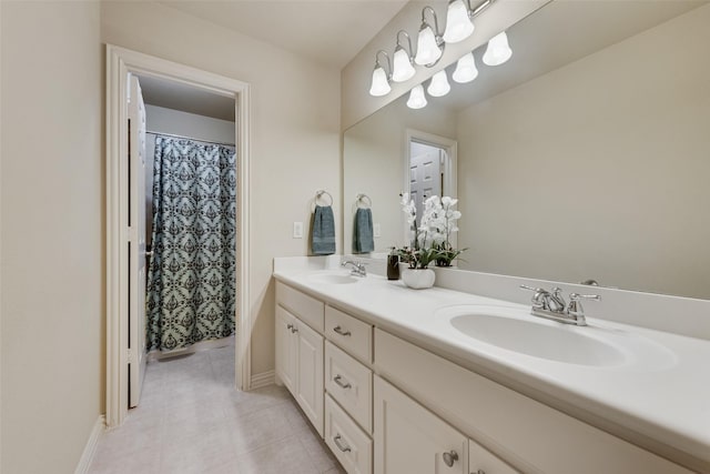 7817 Harvest Hill Ln, Mckinney, TX 75071 - bathroom featuring tile patterned floors, double vanity, and baseboards