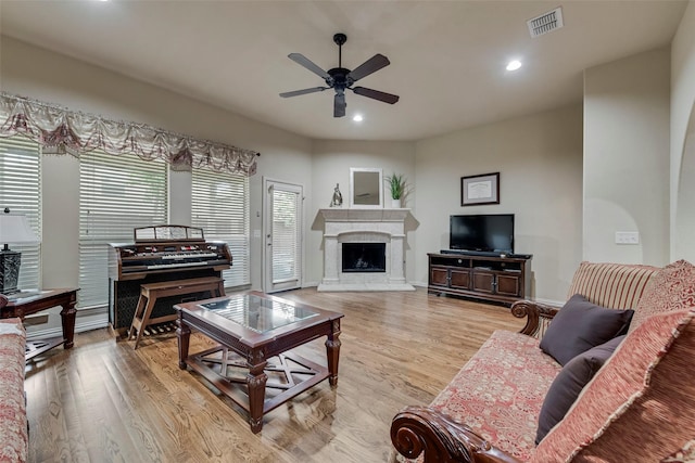 7817 Harvest Hill Ln, Mckinney, TX 75071 - living area featuring a ceiling fan, light wood-style flooring, recessed lighting, and a fireplace with raised hearth