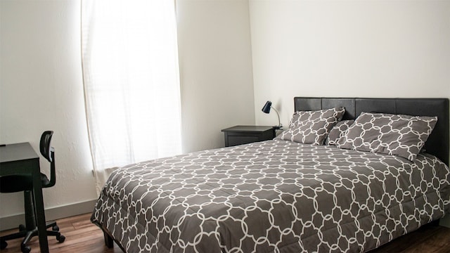 bedroom with wood finished floors