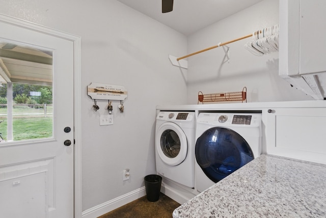 laundry area with separate washer and dryer, baseboards, and a ceiling fan