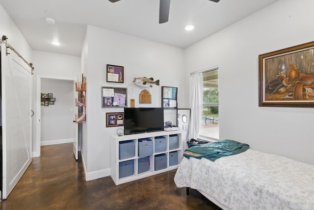 bedroom with a barn door, concrete flooring, baseboards, recessed lighting, and access to exterior