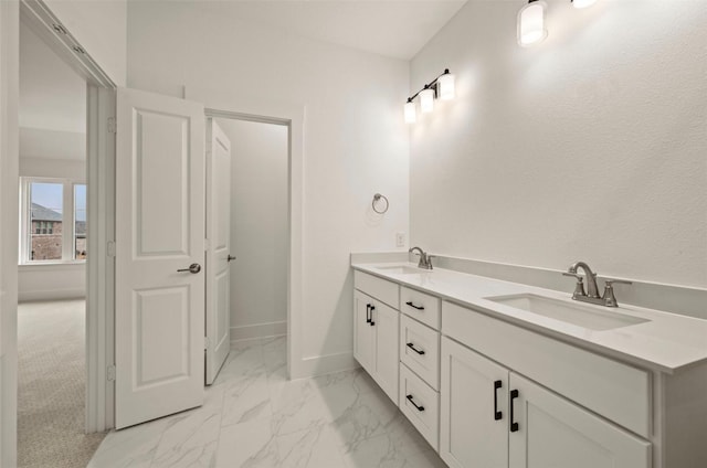 4702 Smokey Quartz Ln, Arlington, TX 76005 - bathroom featuring marble finish flooring, double vanity, and baseboards