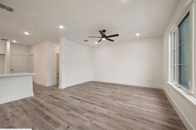 4702 Smokey Quartz Ln, Arlington, TX 76005 - unfurnished living room with recessed lighting, light wood-style floors, ceiling fan, and baseboards