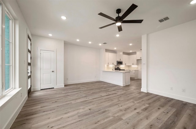4702 Smokey Quartz Ln, Arlington, TX 76005 - unfurnished living room with a ceiling fan, light wood-style floors, recessed lighting, and baseboards