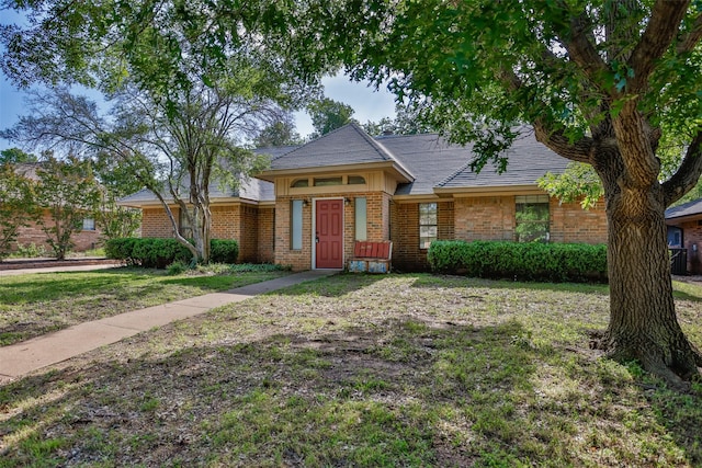 1916 N Lake Trl, Denton, TX 76201 - view of front facade with brick siding and a front yard