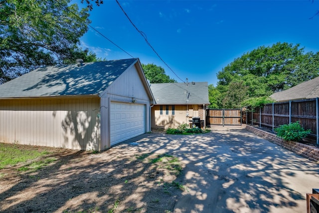 1916 N Lake Trl, Denton, TX 76201 - view of property exterior with fence and a garage