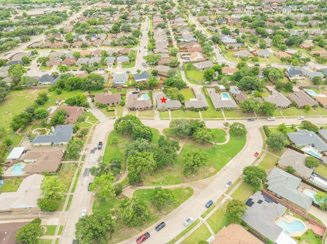aerial view of property's location with nearby suburban area and a pool area
