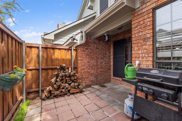 449 Harris St Unit 102D, Coppell, TX 75019 - view of patio / terrace with area for grilling and fence