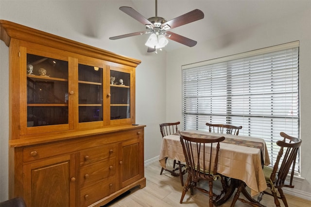 449 Harris St Unit 102D, Coppell, TX 75019 - dining area with ceiling fan, light wood finished floors, healthy amount of natural light, and baseboards