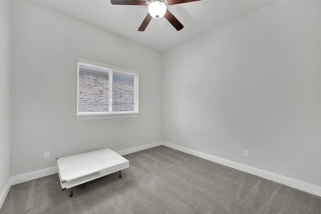 unfurnished room with ceiling fan, carpet floors, and baseboards
