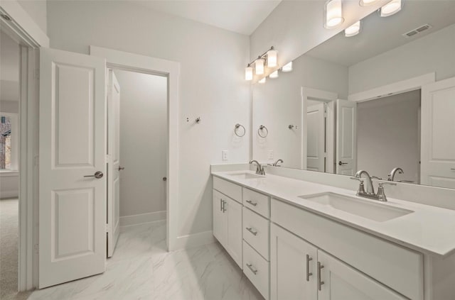 4732 Smokey Quartz Ln, Arlington, TX 76005 - full bathroom featuring marble look tiles, double vanity, and baseboards