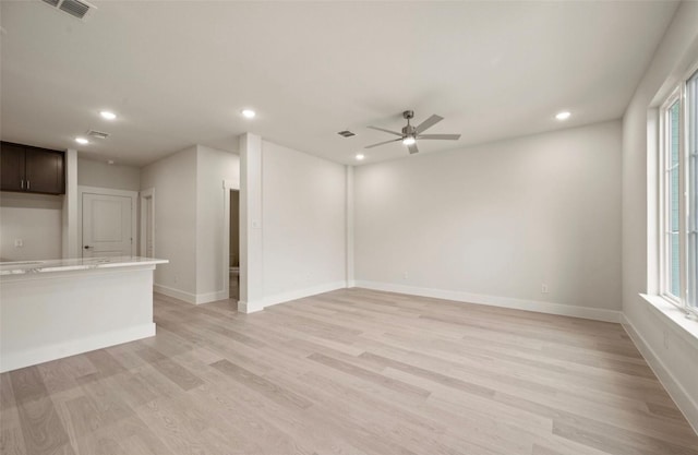 4732 Smokey Quartz Ln, Arlington, TX 76005 - unfurnished living room featuring light wood-style floors, recessed lighting, ceiling fan, and healthy amount of natural light