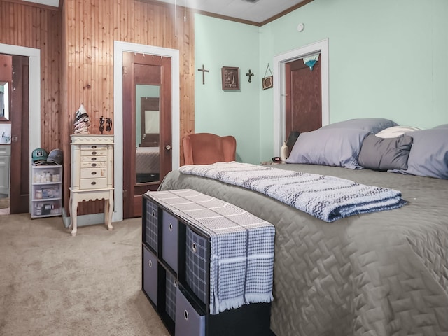 401 S 9th Ave, Teague, TX 75860 - bedroom with wood walls, light carpet, and ornamental molding