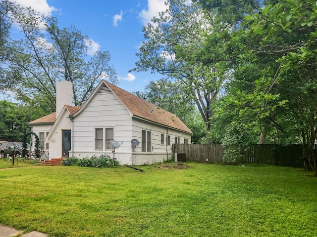 401 S 9th Ave, Teague, TX 75860 - view of property exterior featuring a chimney and central AC