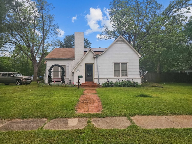 401 S 9th Ave, Teague, TX 75860 - view of front of property featuring a chimney and roof mounted solar panels