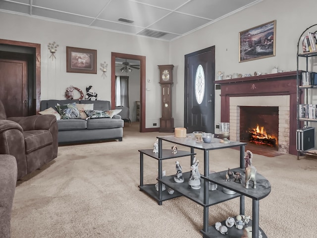 401 S 9th Ave, Teague, TX 75860 - carpeted living room featuring a brick fireplace, ceiling fan, and ornamental molding