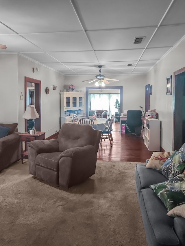 401 S 9th Ave, Teague, TX 75860 - carpeted living area featuring a ceiling fan, crown molding, and baseboards