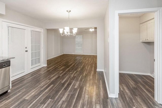 1017 Westminster Ln, Garland, TX 75040 - unfurnished dining area featuring dark wood finished floors, a chandelier, and baseboards
