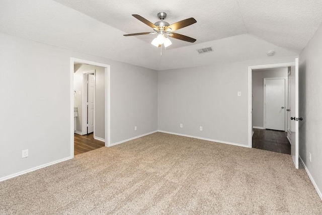 1017 Westminster Ln, Garland, TX 75040 - unfurnished bedroom featuring carpet, vaulted ceiling, a textured ceiling, baseboards, and a ceiling fan