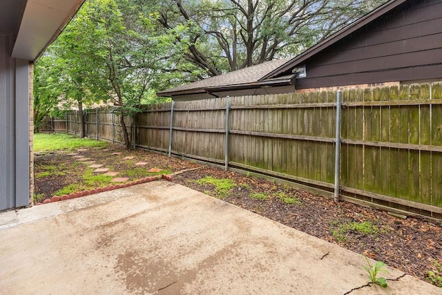 1017 Westminster Ln, Garland, TX 75040 - fenced backyard with a patio area