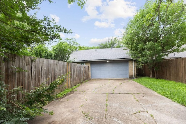 1017 Westminster Ln, Garland, TX 75040 - garage featuring fence and driveway
