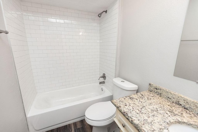 1017 Westminster Ln, Garland, TX 75040 - bathroom featuring toilet, wood finished floors, tub / shower combination, and vanity