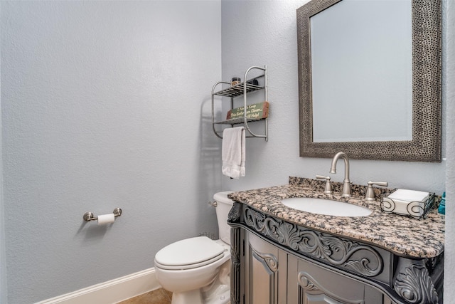 1615 San Andres Dr, Frisco, TX 75033 - bathroom with toilet, vanity, and baseboards