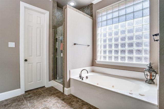 1615 San Andres Dr, Frisco, TX 75033 - bathroom featuring a shower stall, a jetted tub, baseboards, and tile patterned flooring