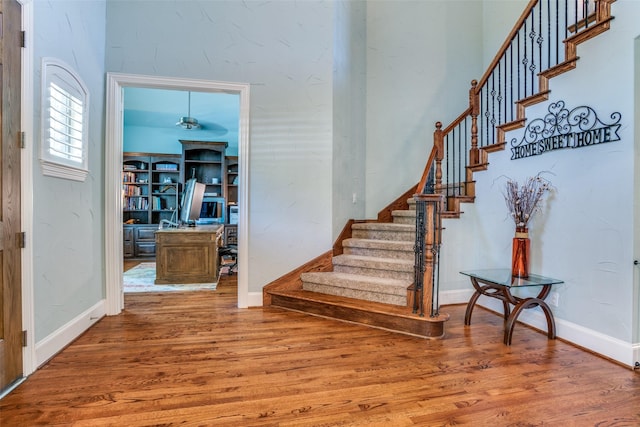 1615 San Andres Dr, Frisco, TX 75033 - stairs featuring wood finished floors, baseboards, and ceiling fan