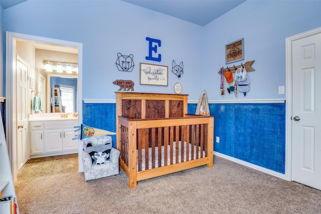 1615 San Andres Dr, Frisco, TX 75033 - bedroom with carpet flooring, wainscoting, and ensuite bath