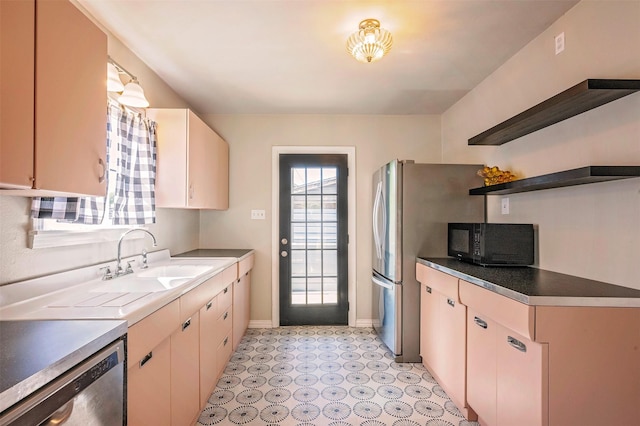 1108 W Jessamine St, Fort Worth, TX 76110 - kitchen featuring stainless steel appliances, a sink, baseboards, open shelves, and light flooring