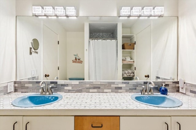 3020 N 43rd St, Waco, TX 76710 - bathroom featuring double vanity, backsplash, and curtained shower