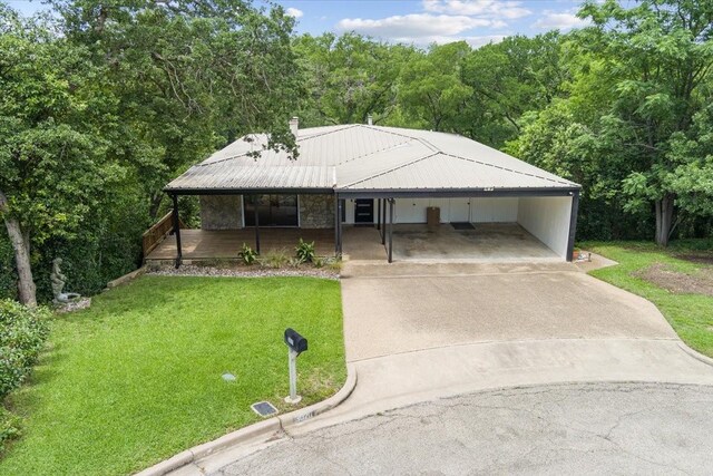 3020 N 43rd St, Waco, TX 76710 - view of front of house with a front yard, concrete driveway, a porch, and a carport