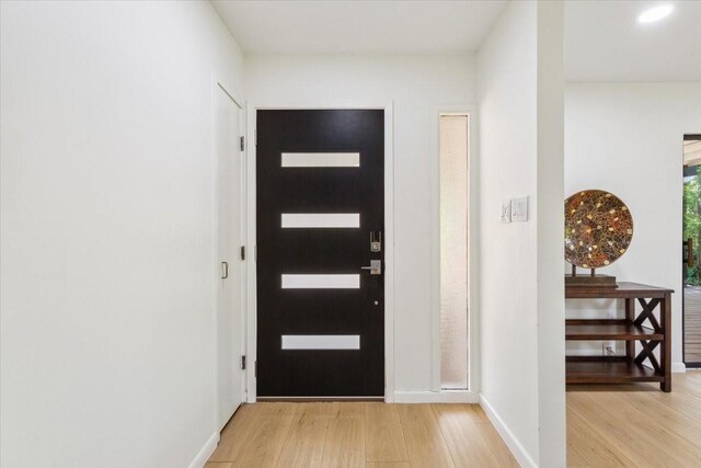 3020 N 43rd St, Waco, TX 76710 - foyer entrance with light wood-style floors and baseboards