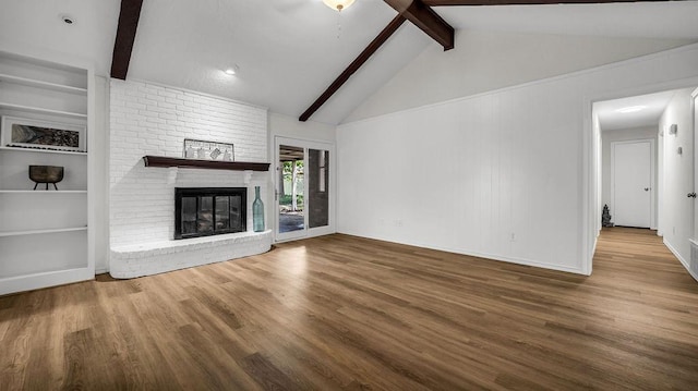 unfurnished living room with wood finished floors and a fireplace